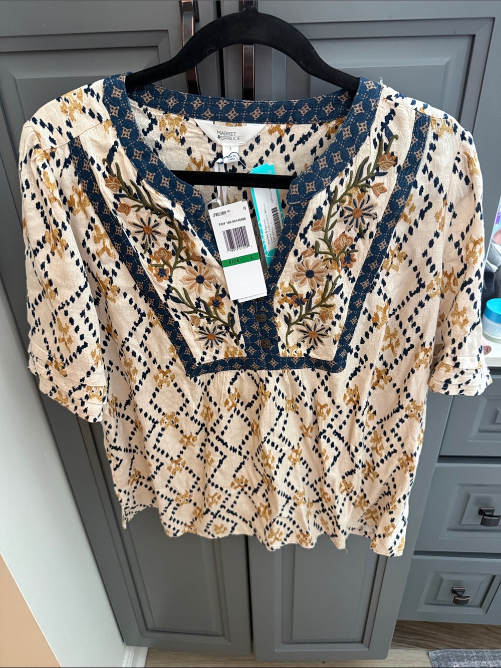 Market & Spruce Cream Top with Navy and Mustard Embroidery small hole